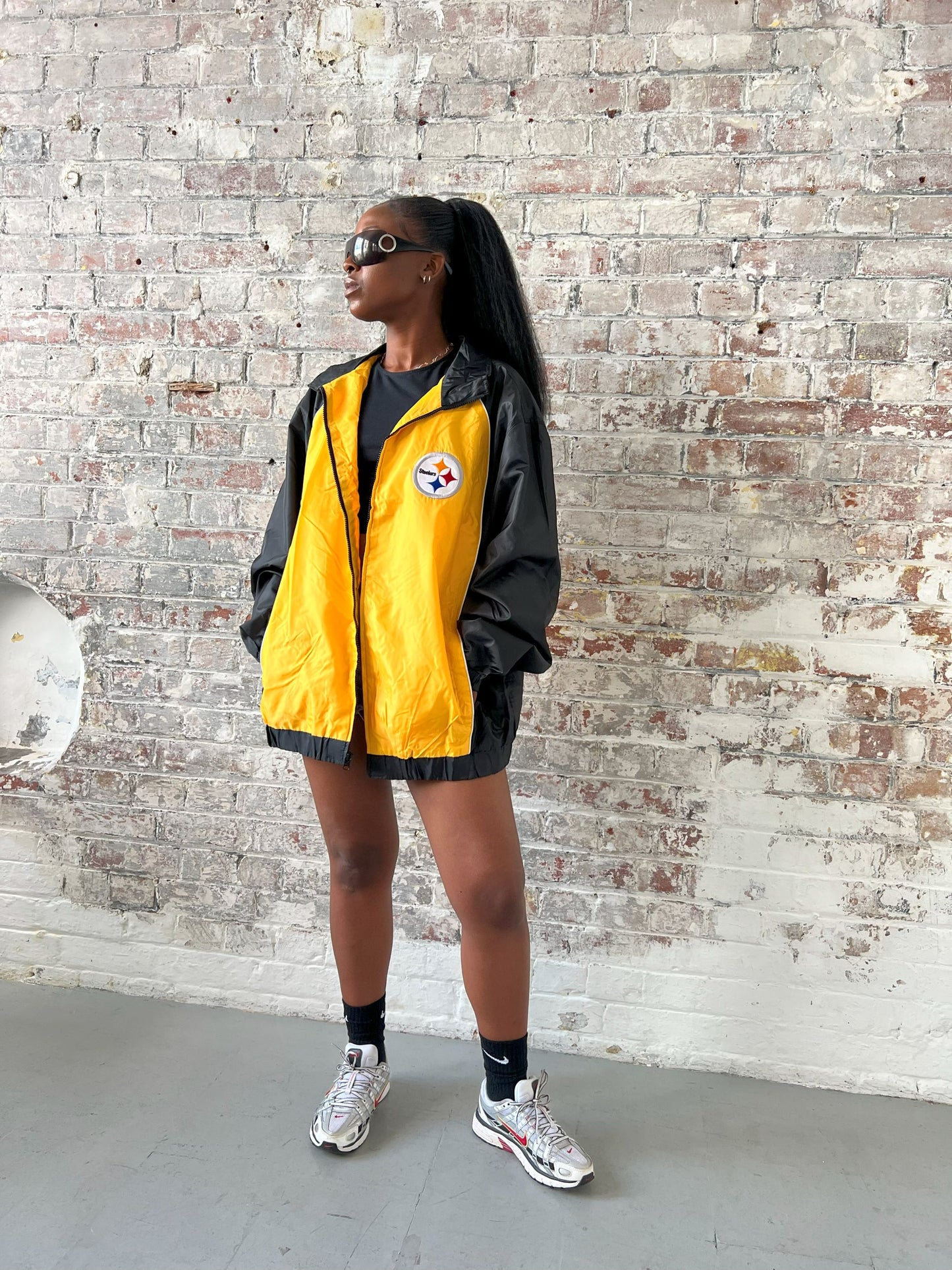 Vintage American Athletics NFL Jacket in black and yellow