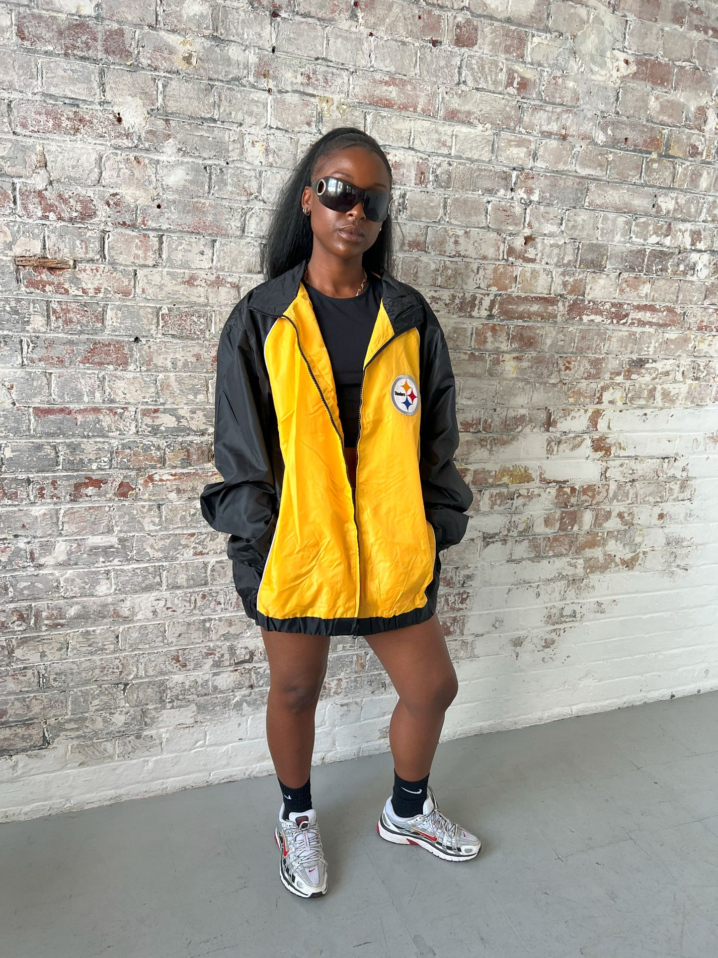 Vintage American Athletics NFL Jacket in black and yellow