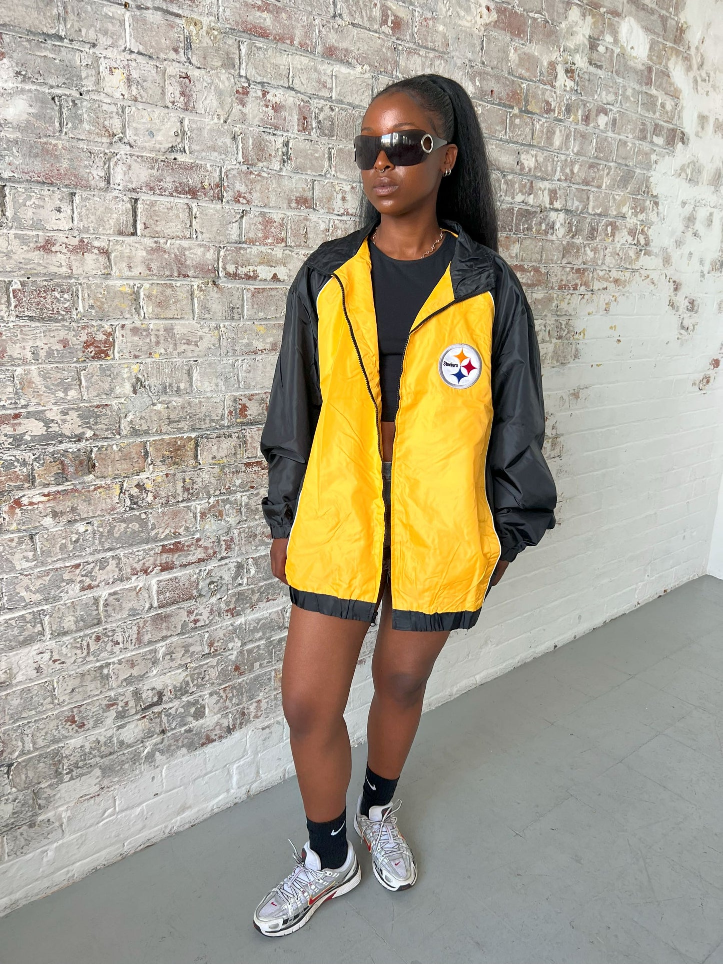 Vintage American Athletics NFL Jacket in black and yellow