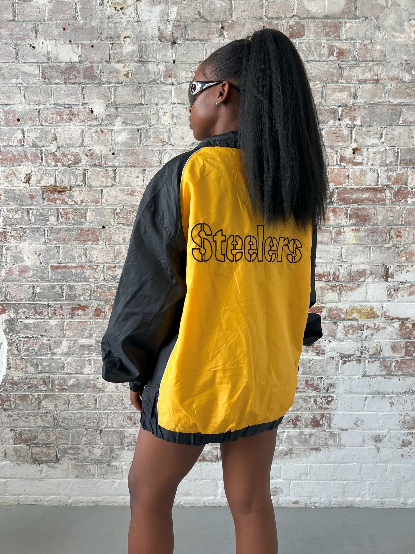 Vintage American Athletics NFL Jacket in black and yellow