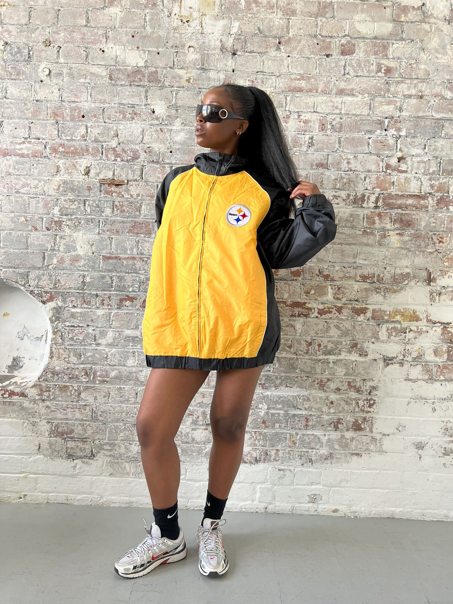 Vintage American Athletics NFL Jacket in black and yellow