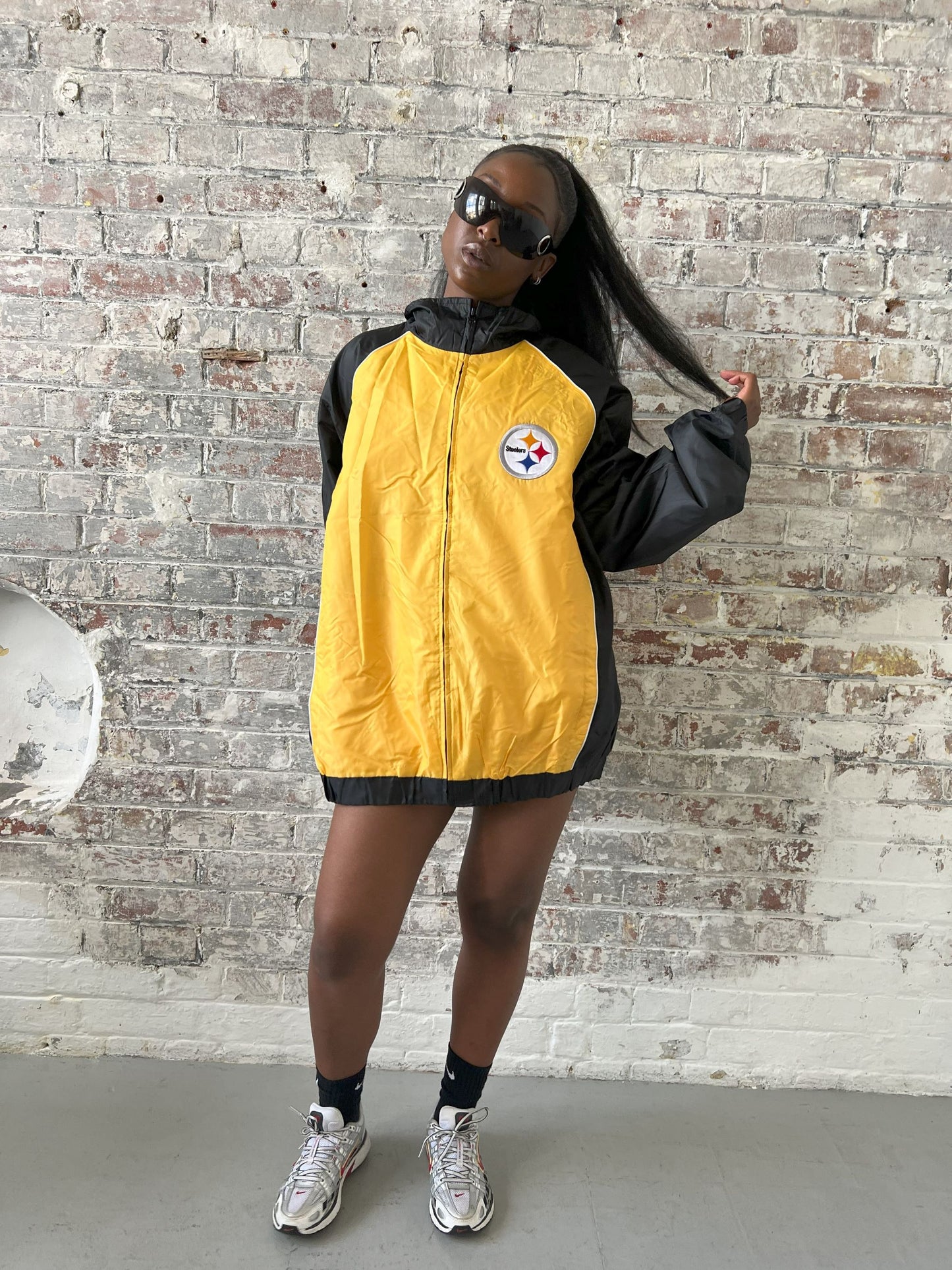 Vintage American Athletics NFL Jacket in black and yellow